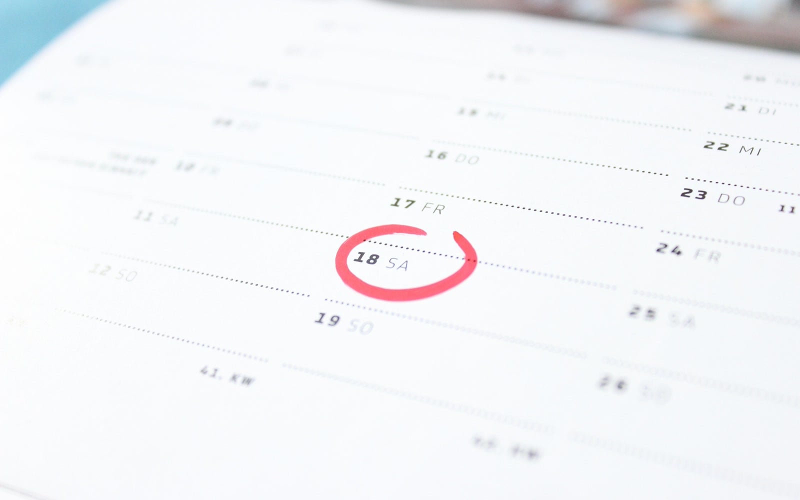 A date circled in red on a calendar