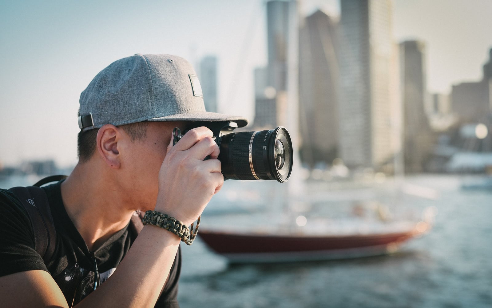 A photographer looks through a camera viewfinder